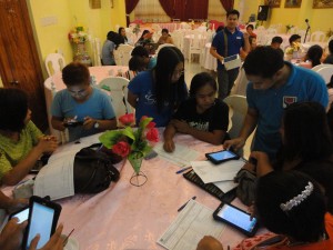 Listahanan Regional Information and Technology Officer Mark Anthony Gapoy assists the enumerators in using the tablet computers to lessen possible difficulties in the use of such during the field assessment.